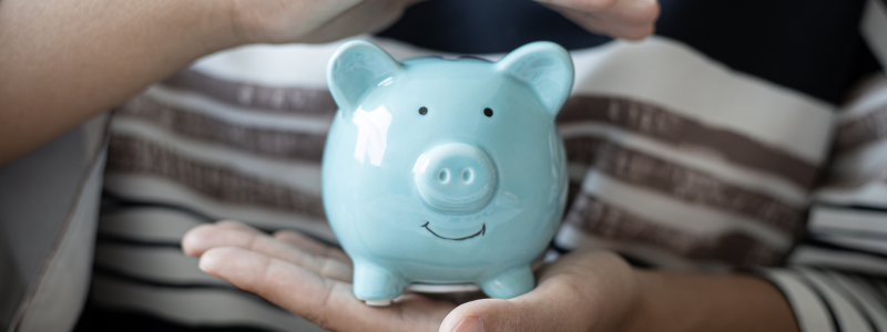 Piggy bank wearing glasses representing financial savings